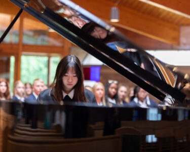 a girl student playing the piano